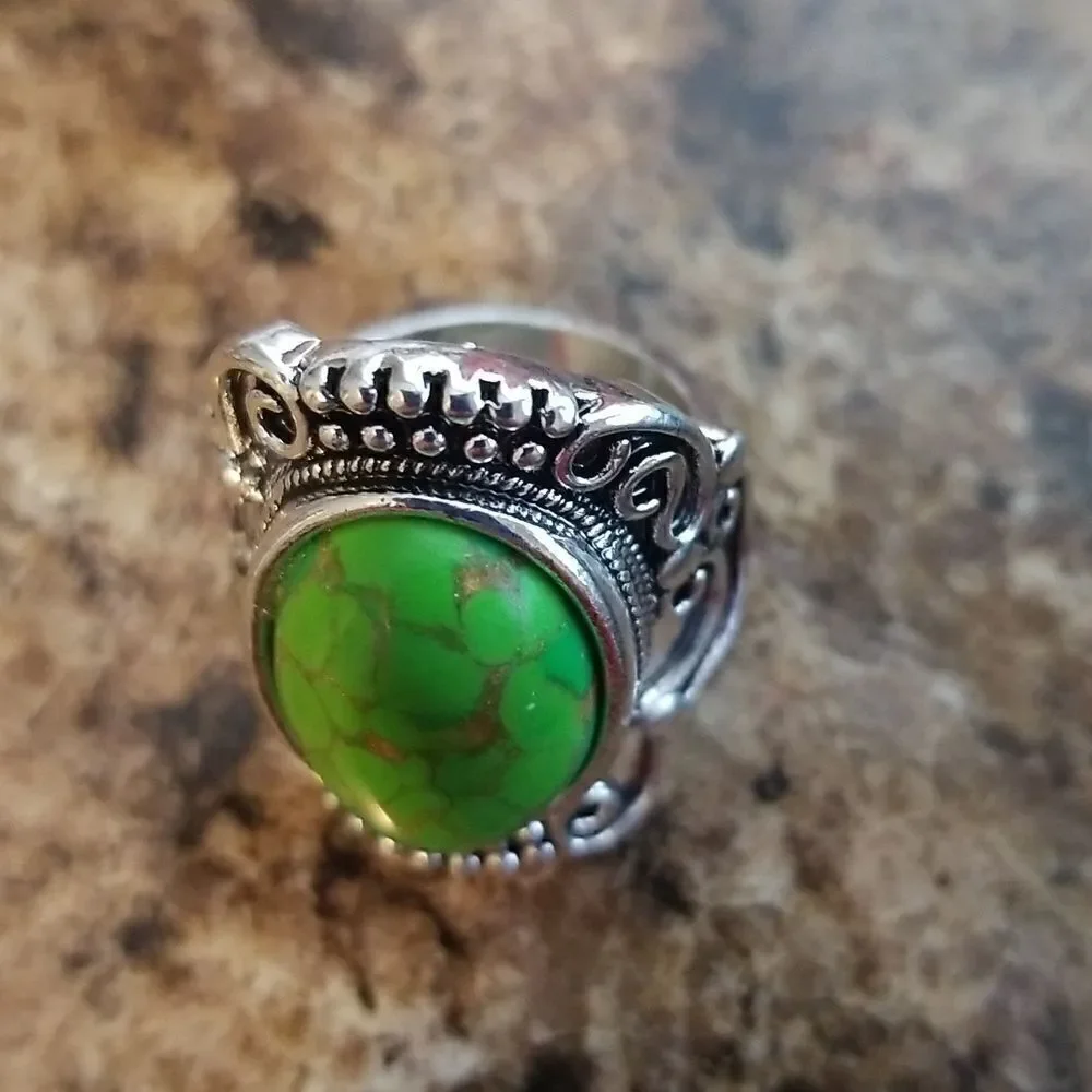 Inlaid turquoise egg shape carved ring size 8